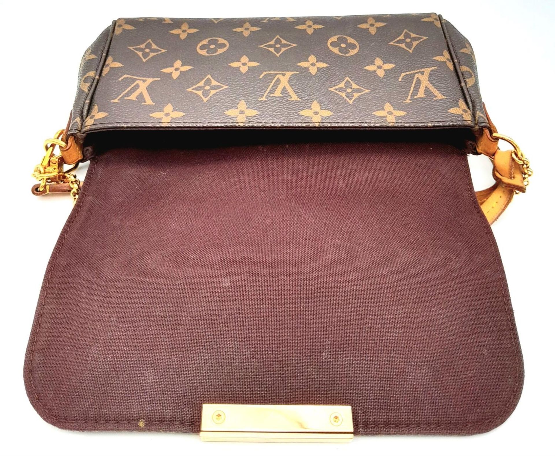 A Louis Vuitton Favourite PM Bag. Monogramed canvas exterior with gold-toned hardware, thin - Image 6 of 15