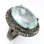 A 7.35ct Aquamarine Gemstone Ring with a 0.90ctw of Diamond Surrounds. Set in 925 Silver. Size N.