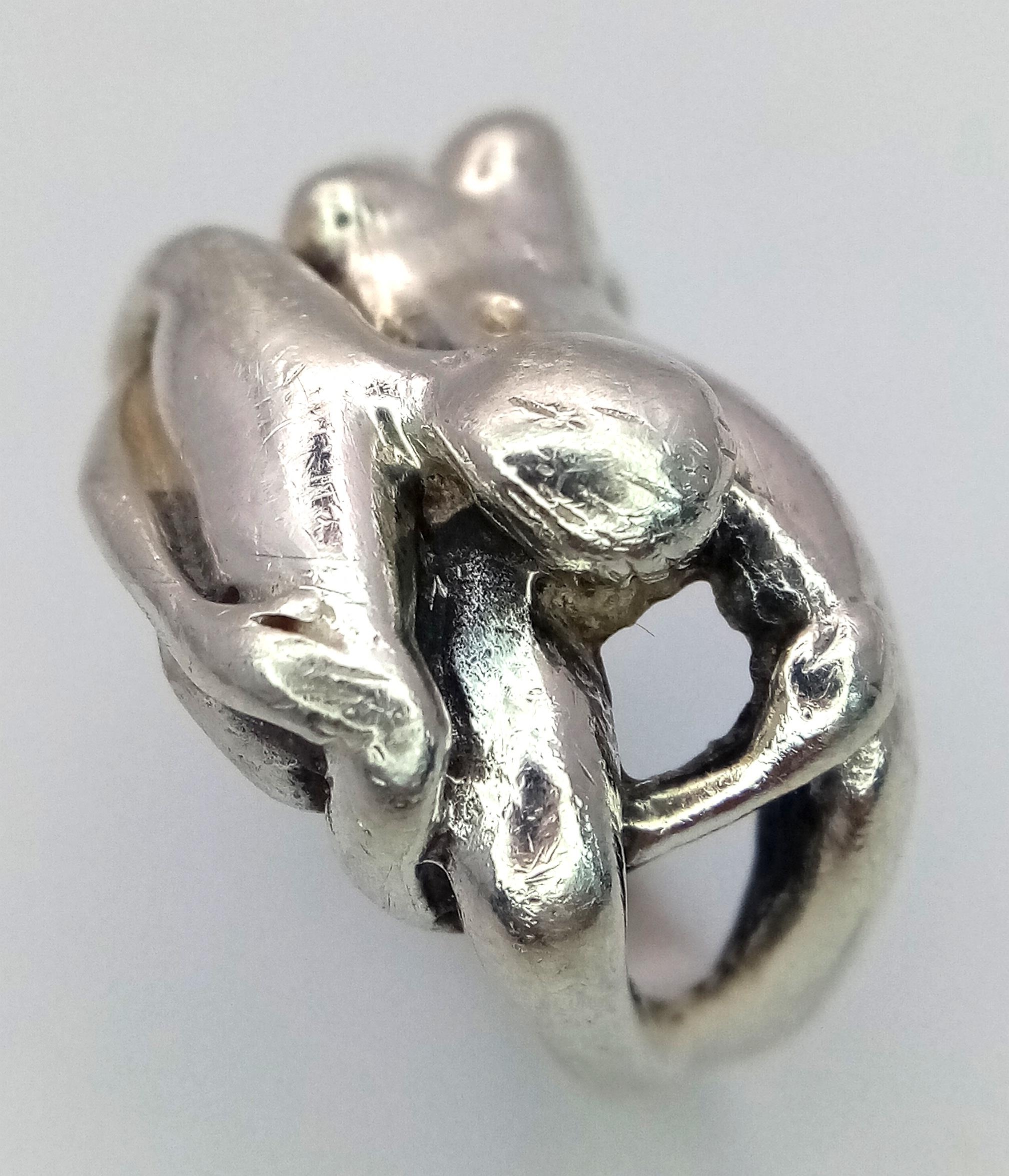 A Vintage and Rare Sterling Silver Erotic Design Ring Size N-N1/2. Measures 1.4cm Wide at the