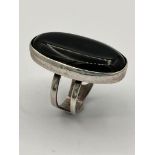 Vintage SILVER and BLACK ONYX RING. Consisting a large oval Black Onyx set in a silver mount. The