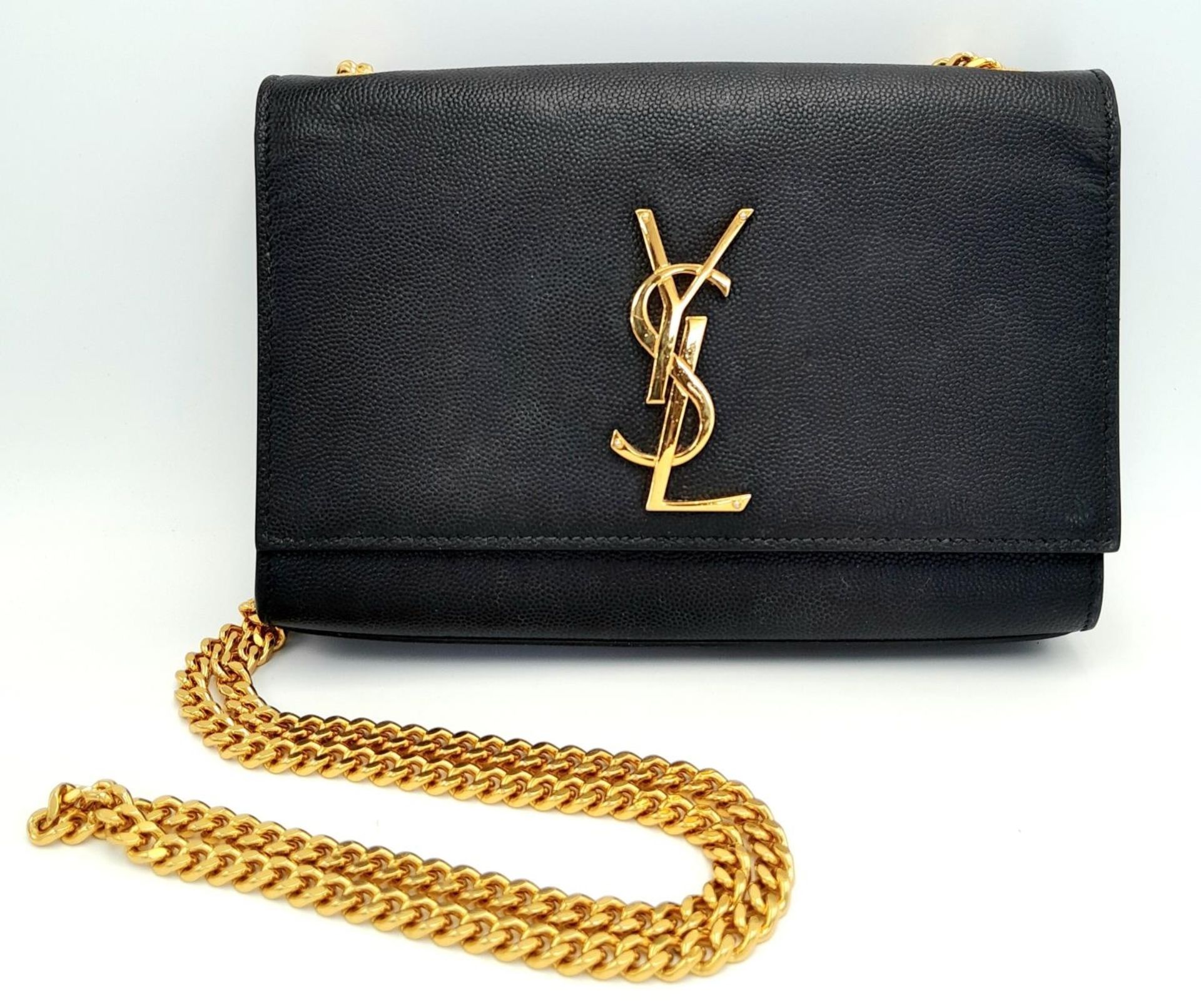 A Saint Laurent Black Kate Crossbody Bag. Leather exterior with gold-toned hardware, the iconic