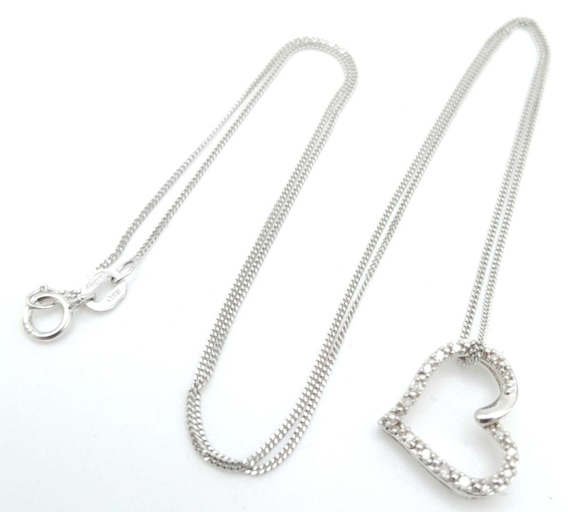 A 9K White Gold Diamond Heart Pendant Necklace. Comes with presentation box. 1.3cm pendant, 45cm