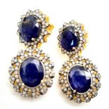 A Pair of Blue Sapphire Gemstone Drop Earrings with Diamond Surrounds. Set in gilded 925 Silver.