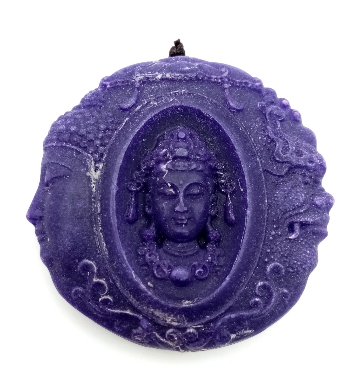 A Lavender Jade Devil and Angel Pendant. Highly symbolic of todays times. Circular shape. 5cm.