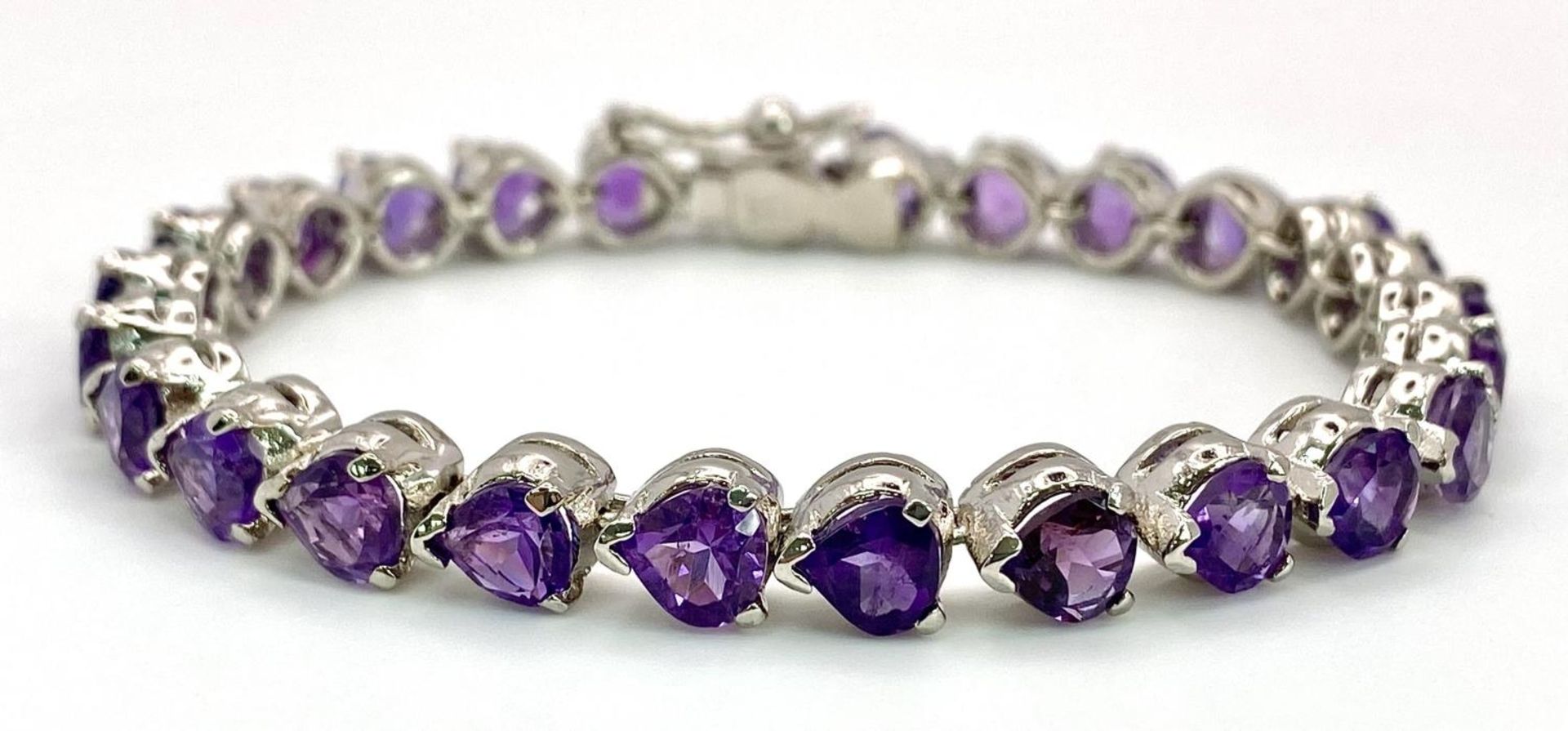 An Amethyst Gemstone Tennis Bracelet set in 925 Silver. Heart shaped amethysts. 18cm. 25g. Ref: CD- - Image 2 of 4