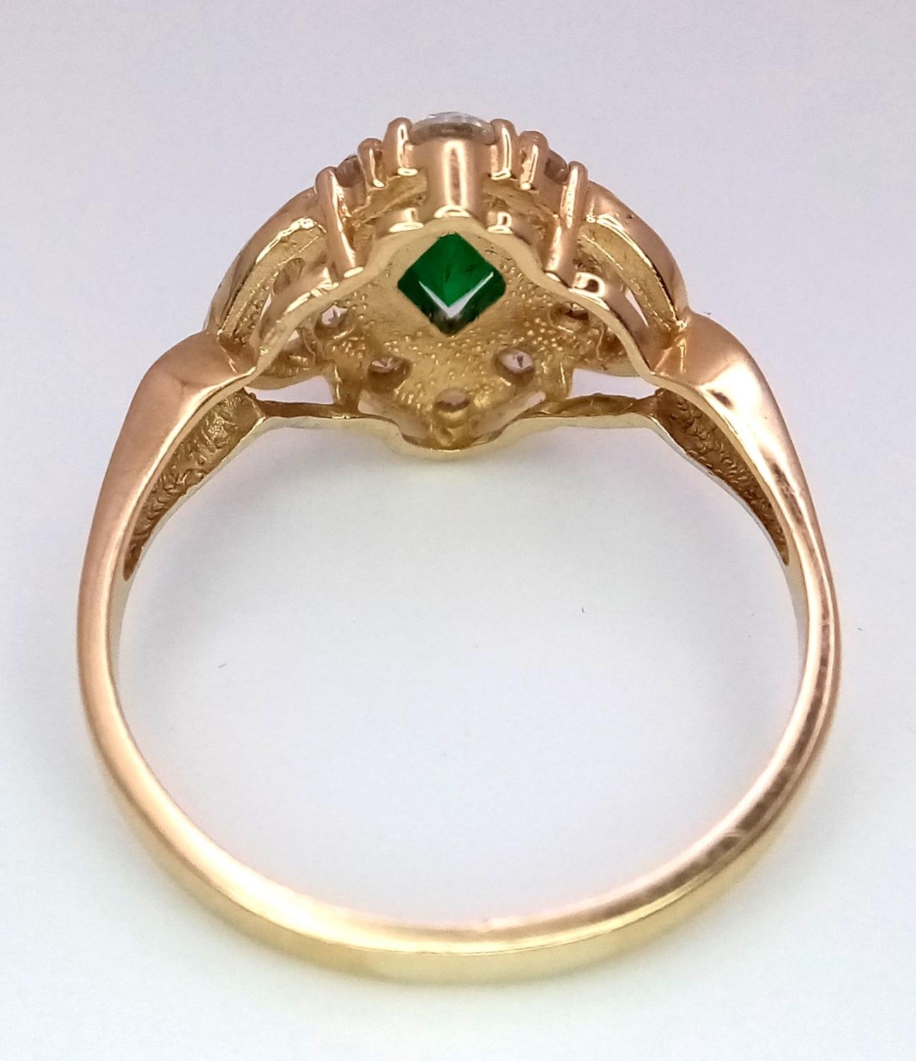 A 14K Yellow Gold Emerald and White Stone Ring. 1.2ct emerald. Size O, 3.34g total weight. - Image 4 of 5