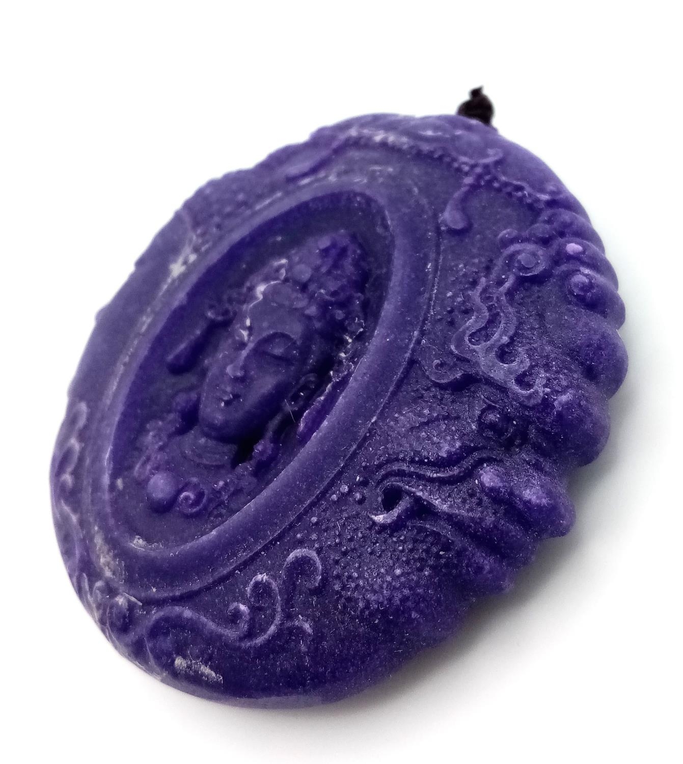 A Lavender Jade Devil and Angel Pendant. Highly symbolic of todays times. Circular shape. 5cm. - Image 3 of 5