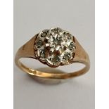 9 carat GOLD and DIAMOND RING, having 9 x small DIAMONDS set to top in PLATINUM MOUNT. Full UK
