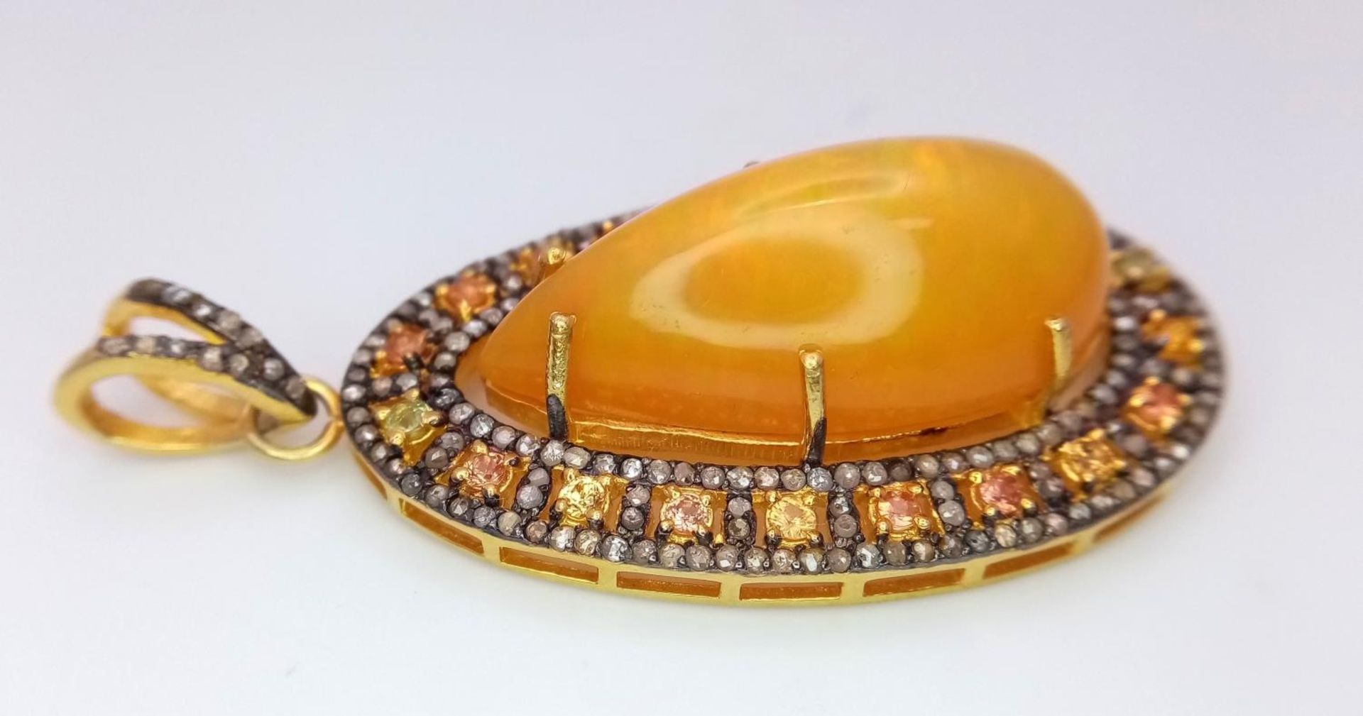 An Australian Fire Opal Pendant with Yellow Sapphires and Old Cut Diamond Surround set in Gilded 925 - Image 3 of 4