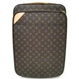 A Louis Vuitton Monogram Pegase Suitcase. Durable leather exterior with gold-toned hardware. Front