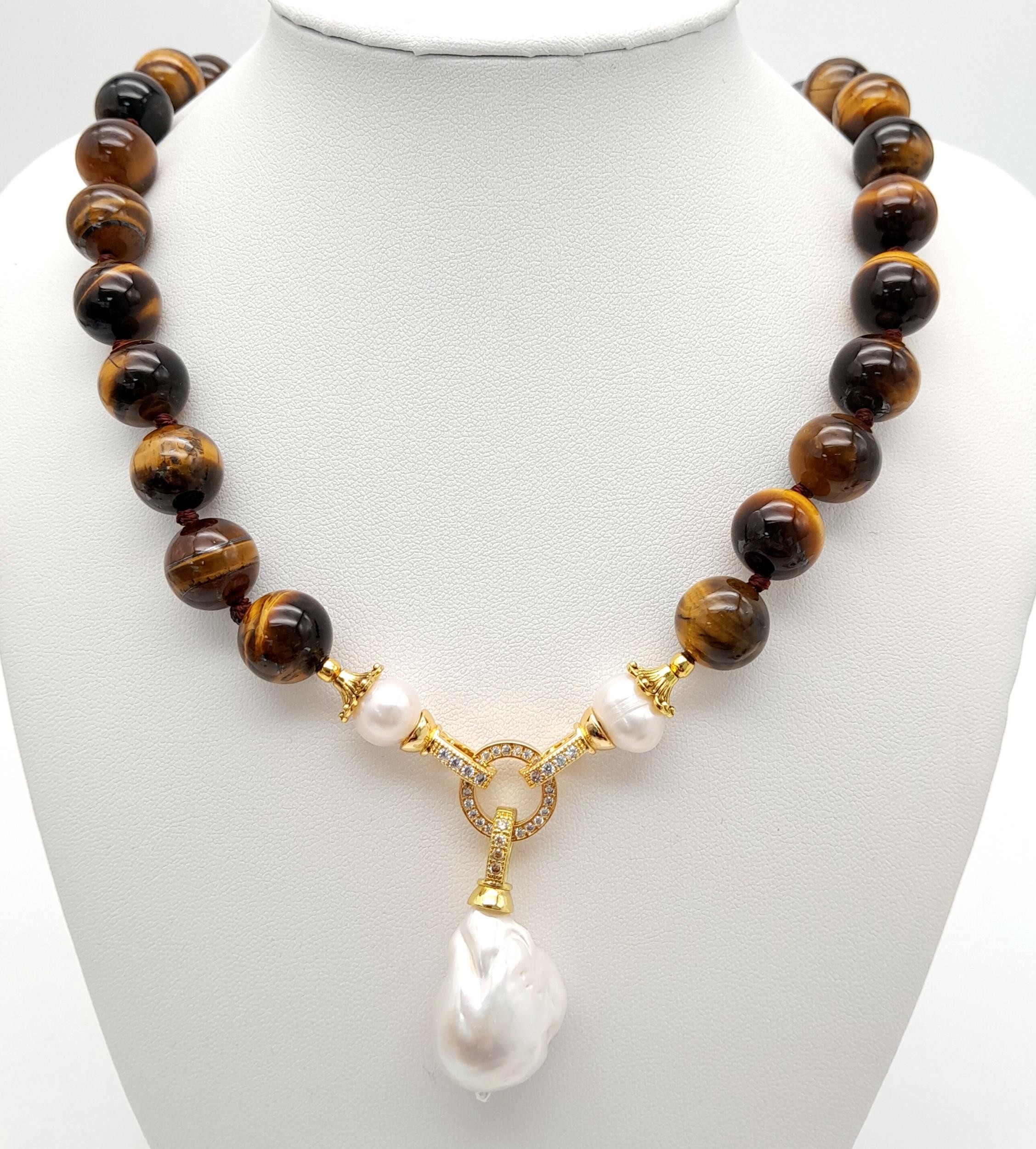 A Rich Tigers Eye Beaded Necklace with a Hanging Keisha Baroque Pearl Pendant. 12mm beads.