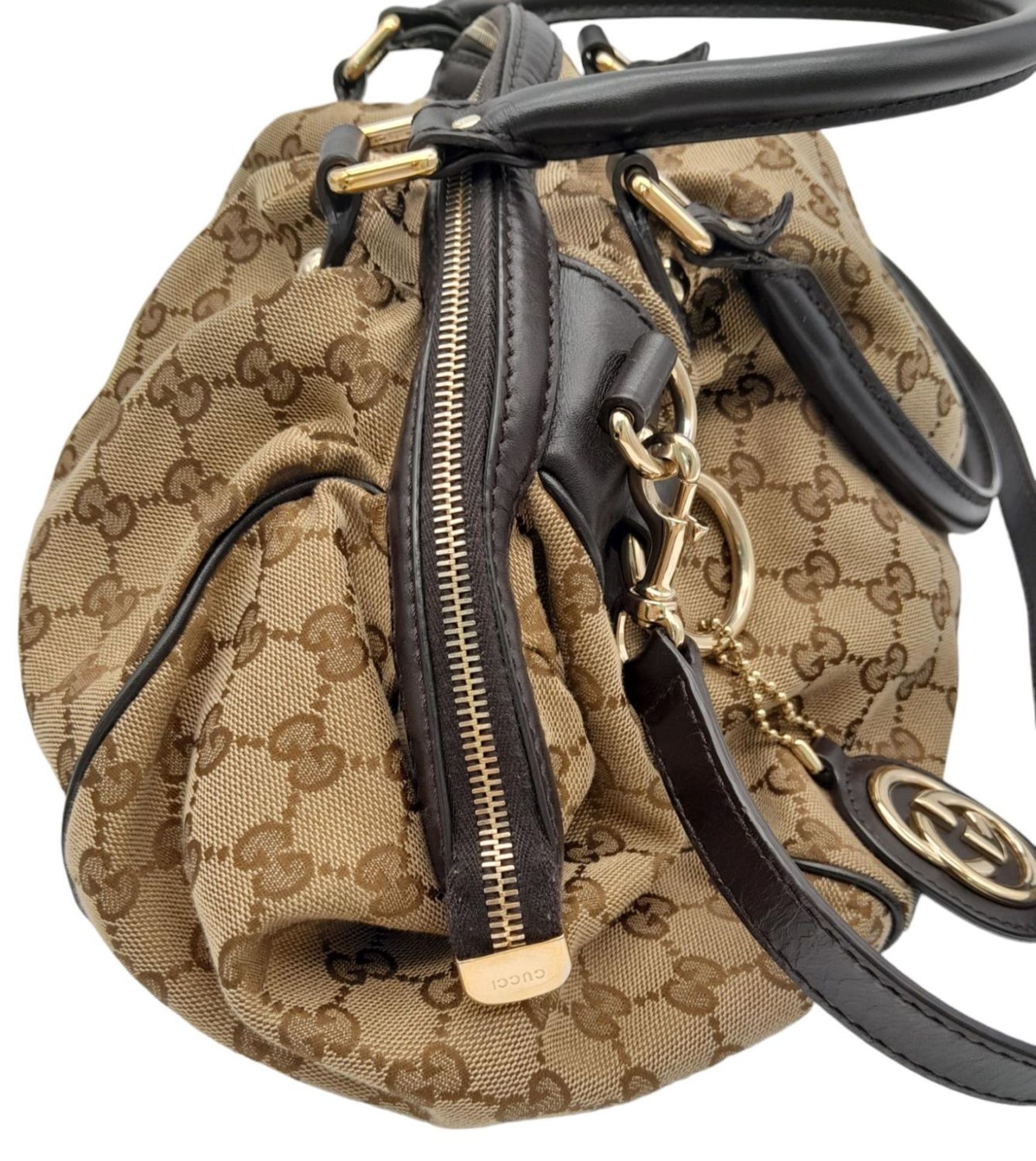 A Gucci Monogram Sukey Satchel Bag. Canvas exterior with leather trim, two rolled leather handles, - Image 4 of 9