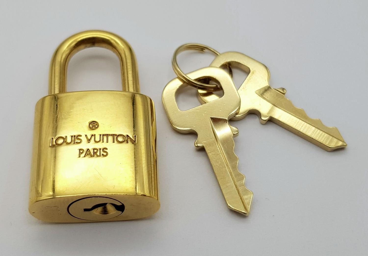 A Louis Vuitton Gold Plated Lock with Two Keys. - Image 2 of 5
