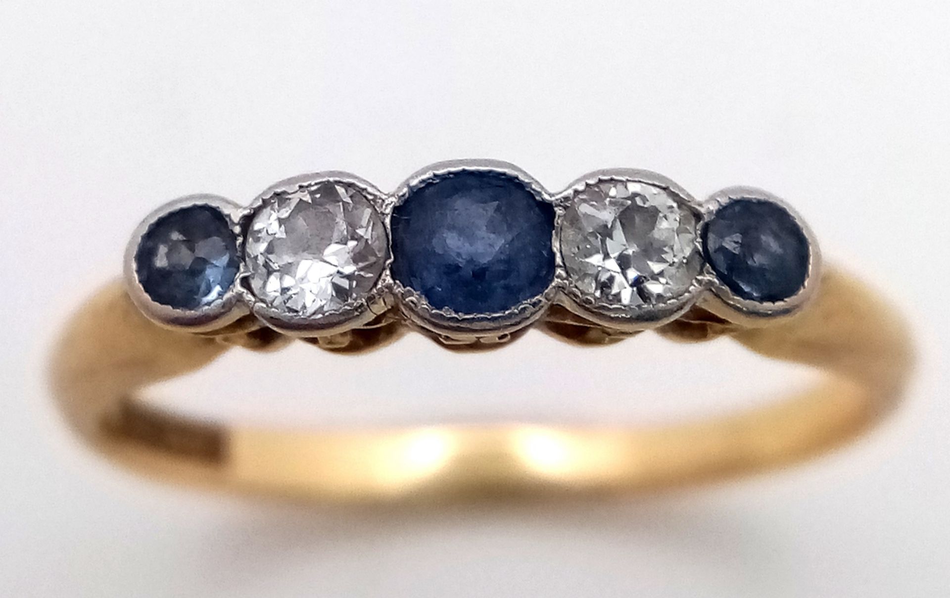 An 18K Gold (tested) Diamond and Pale Blue Sapphire Ring. Size O. 2.6g total weight. - Image 3 of 6