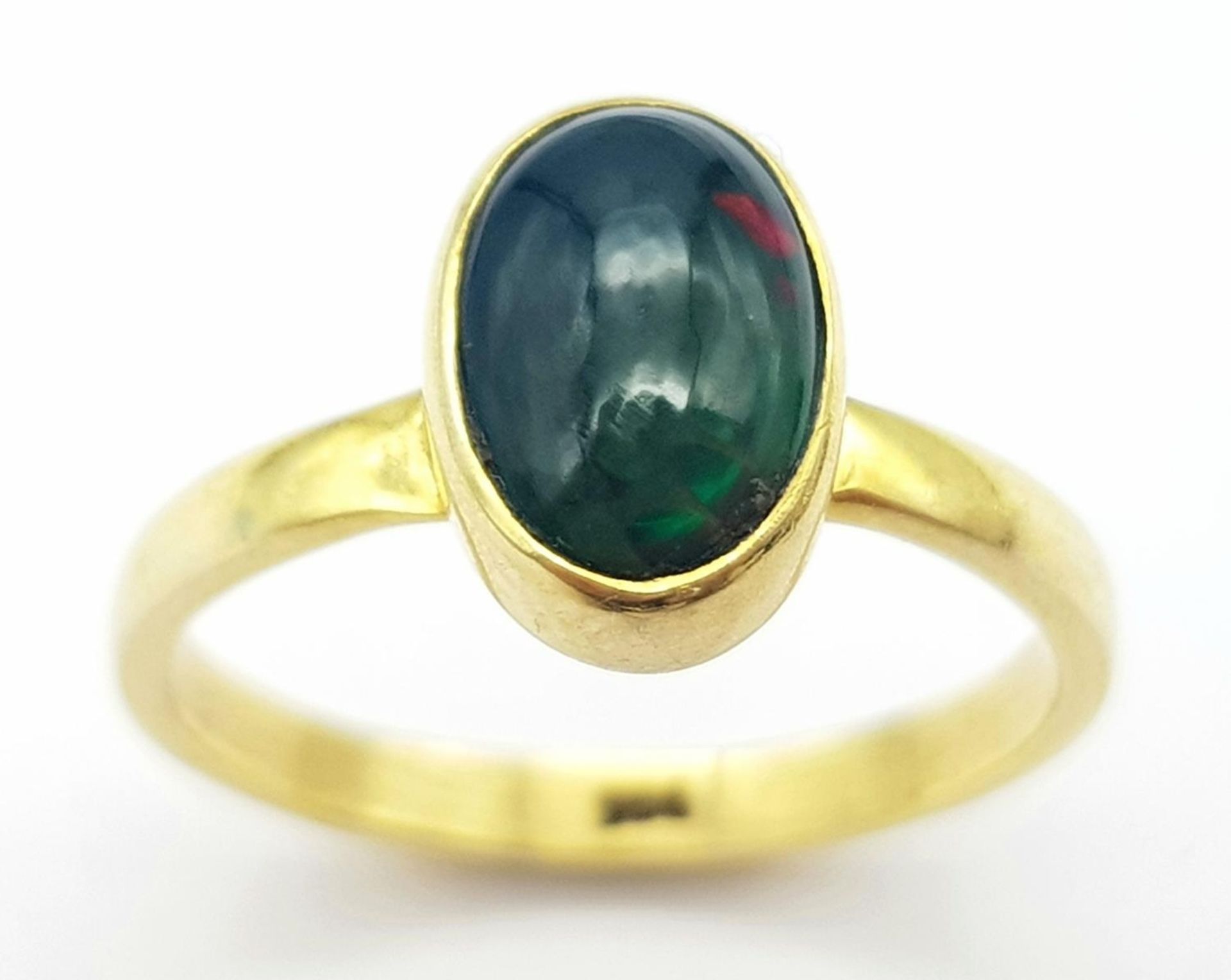 A Black Opal Gilded 925 Silver Ring. Size M/N, 2.1g total weight.