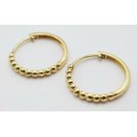 A Pair of 14k Gold Designer Massika Earrings. 1.8g total weight.