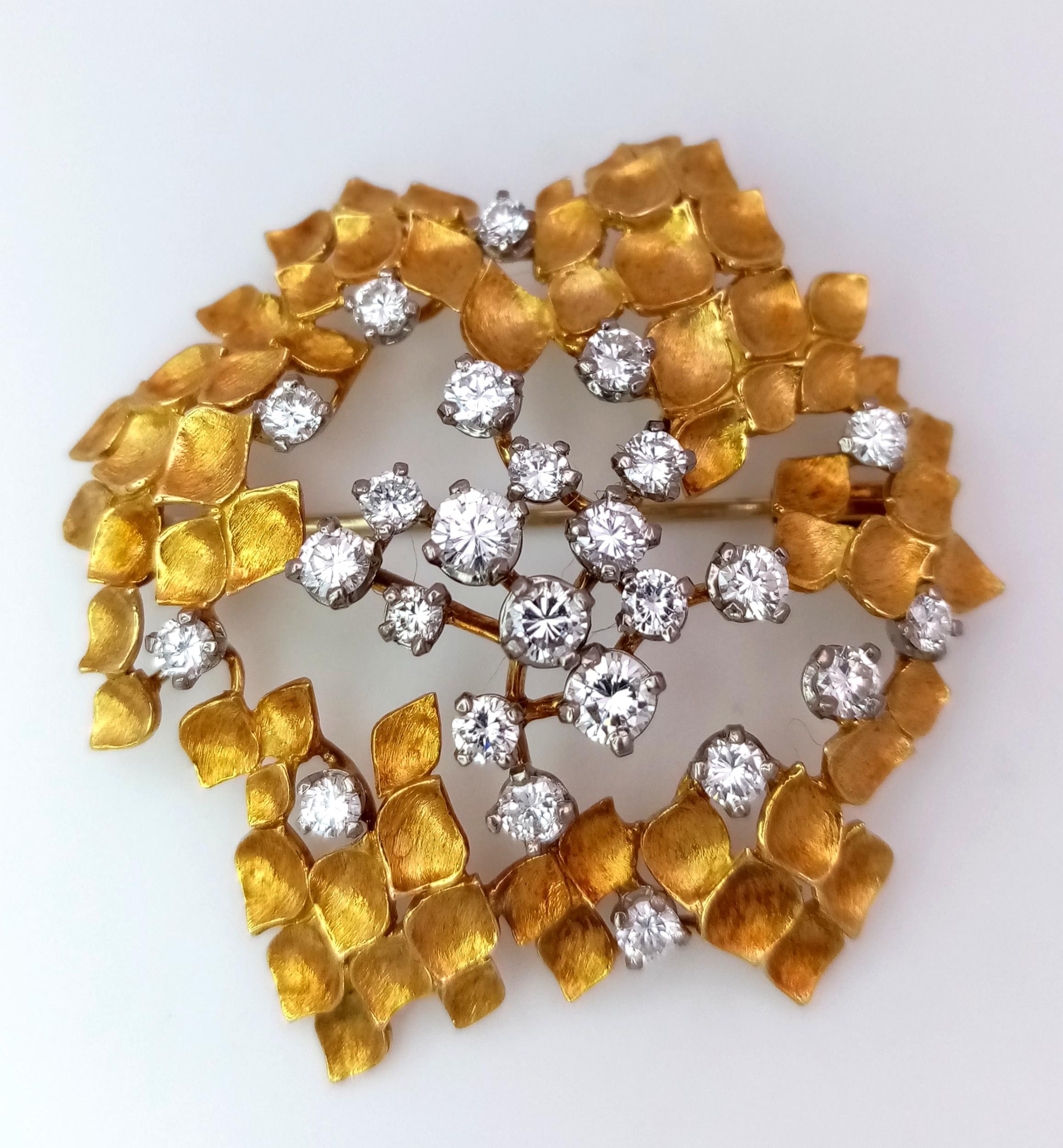 A Magical 18K Yellow Gold and Diamond Brooch. 1.5ctw of brilliant round cut diamonds amongst