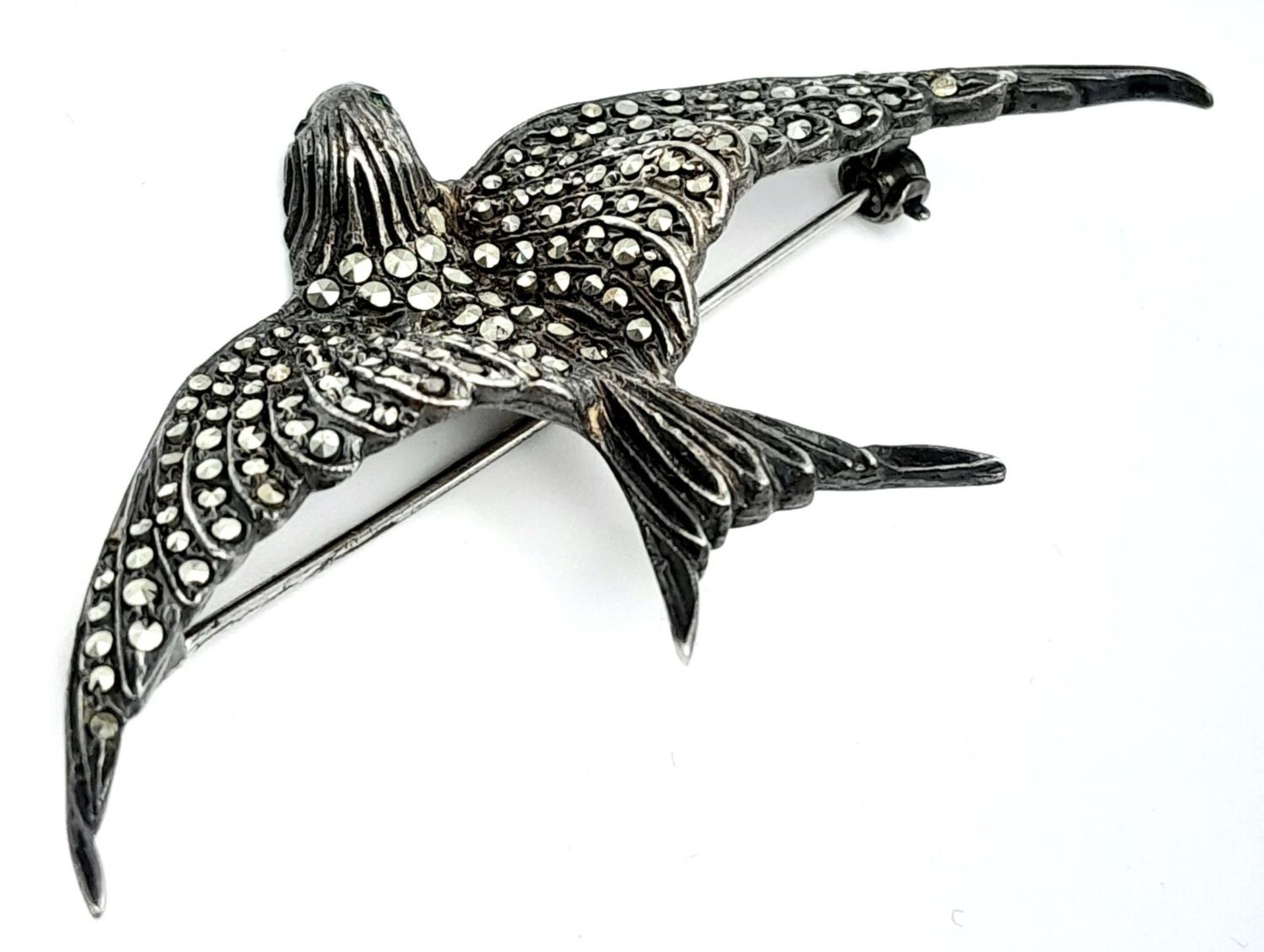 A Vintage Silver and Marcasite Brooch of a Bird in Flight. 7cm wingspan. Green stone eyes. - Image 2 of 7