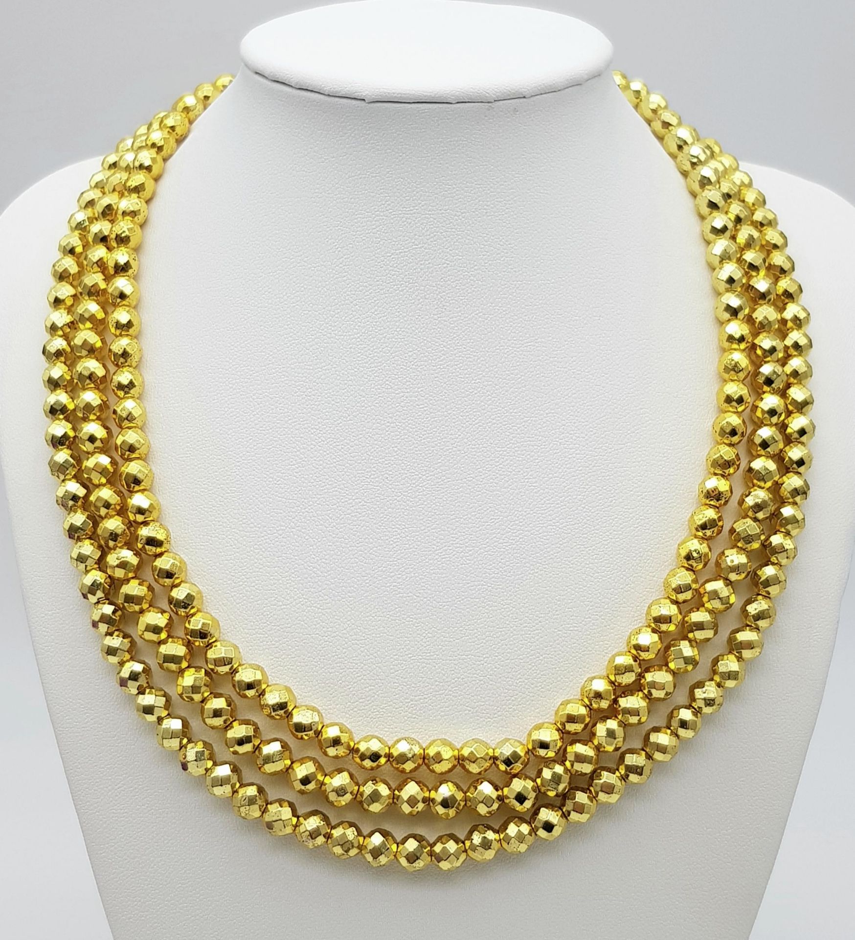 A Limited Edition (1 of 200), 679.65 Carat, Gold Haematite Bead Necklace. Fully Certified