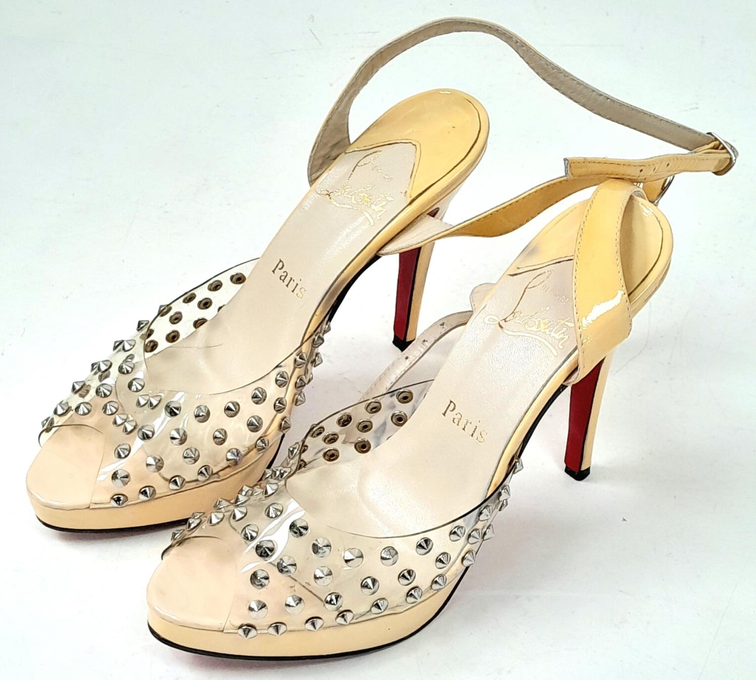 A pair of lightly used high heel (4inch) shoes by Louboutin.