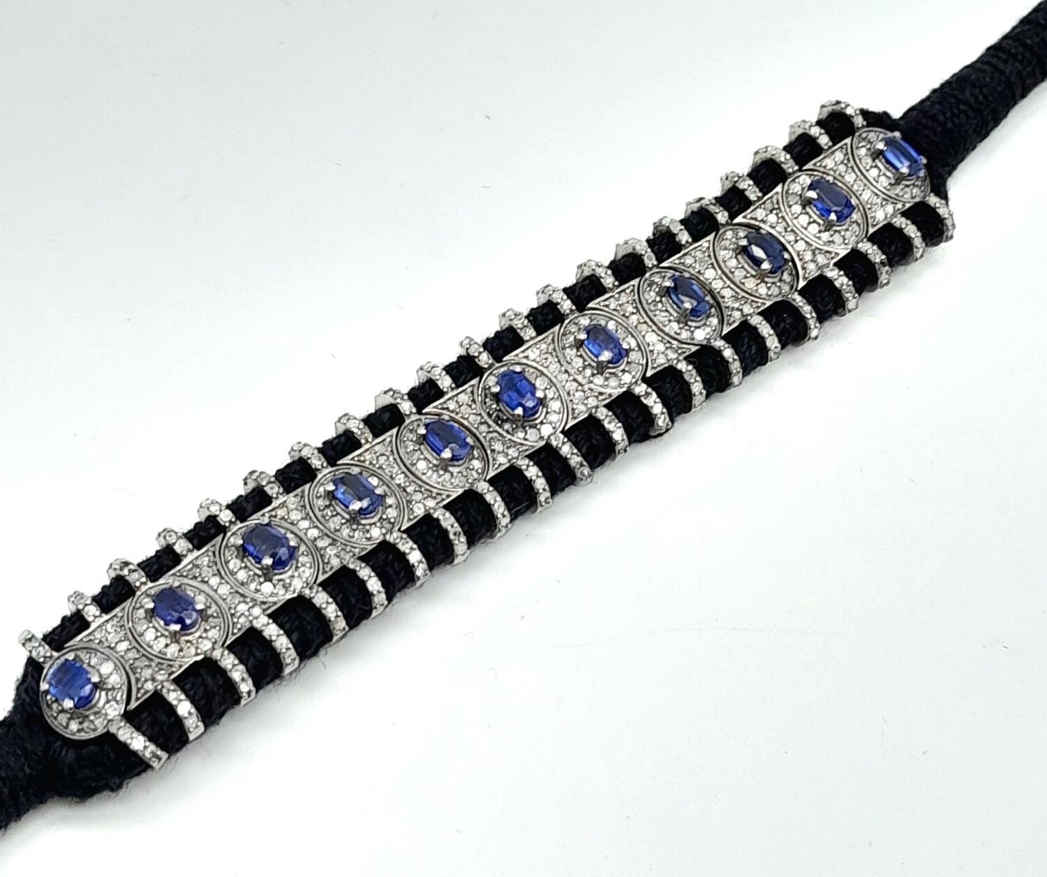 A Hand-Crafted Blue Sapphire and Diamond Encrusted Bracelet. Black textile set. Sapphires - 5ctw. - Image 4 of 8