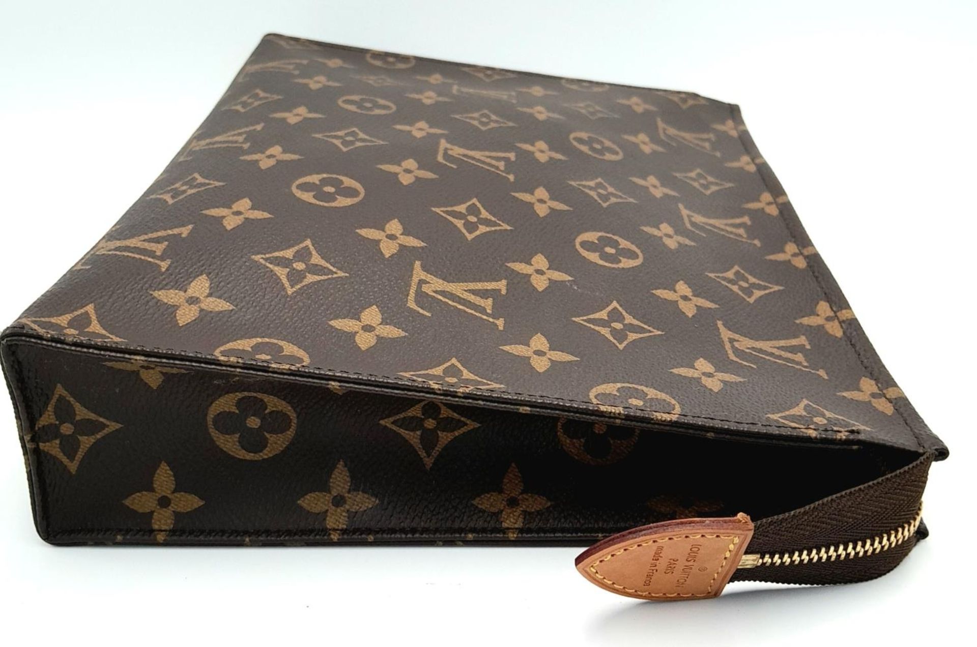 A Louis Vuitton Toiletries Pouch. Monogramed canvas exterior with gold-toned hardware and zipped top - Image 3 of 9