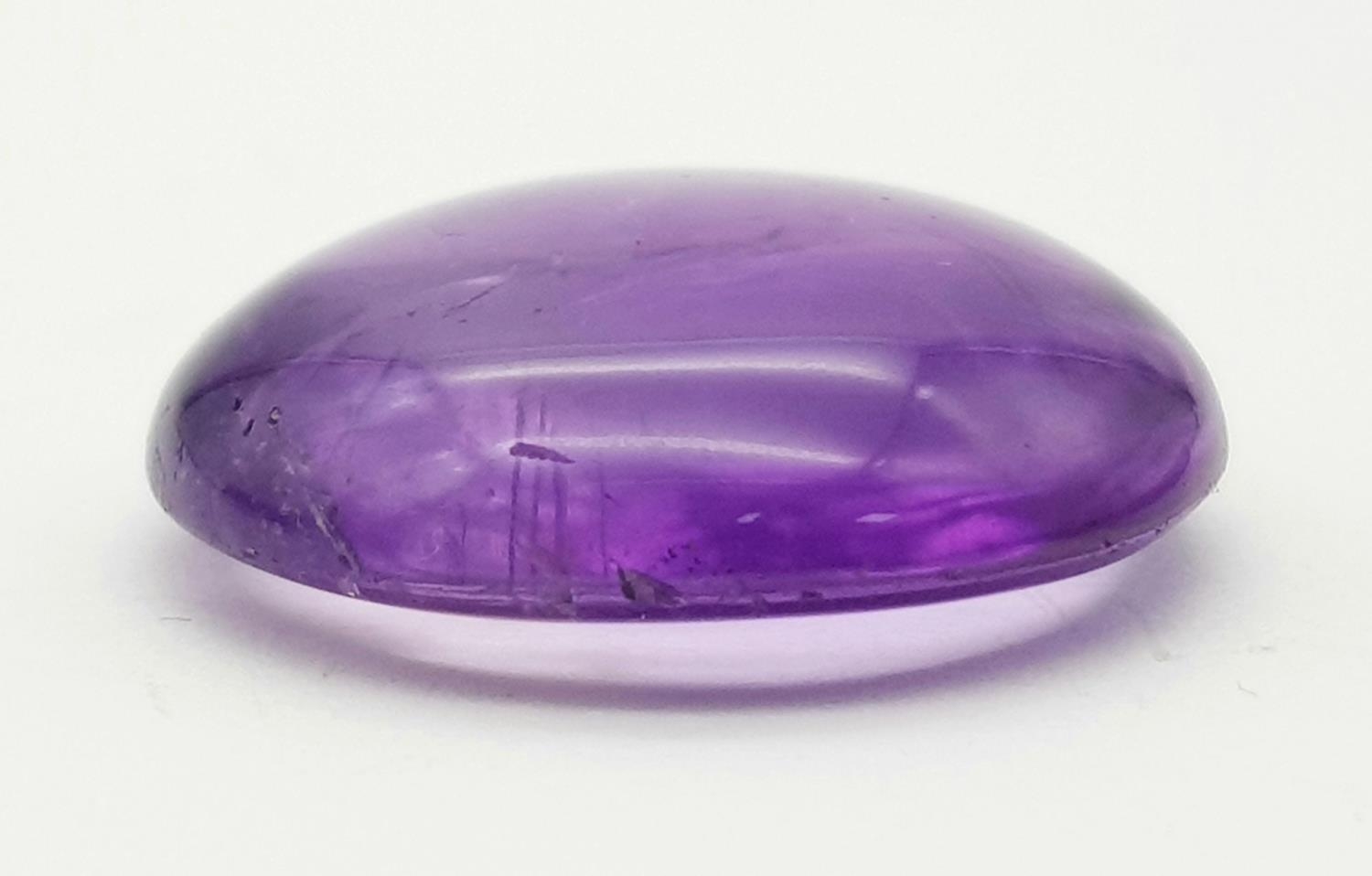 A 26.95ct Amethyst Cabochon Gemstone - GFCO Swiss Certified. - Image 2 of 5