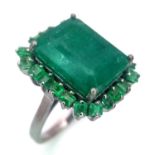 A 6.45ct Emerald Ring with 0.90ctw of Emerald Accents. Set in 925 Silver. Size L. Ref: CD-1331