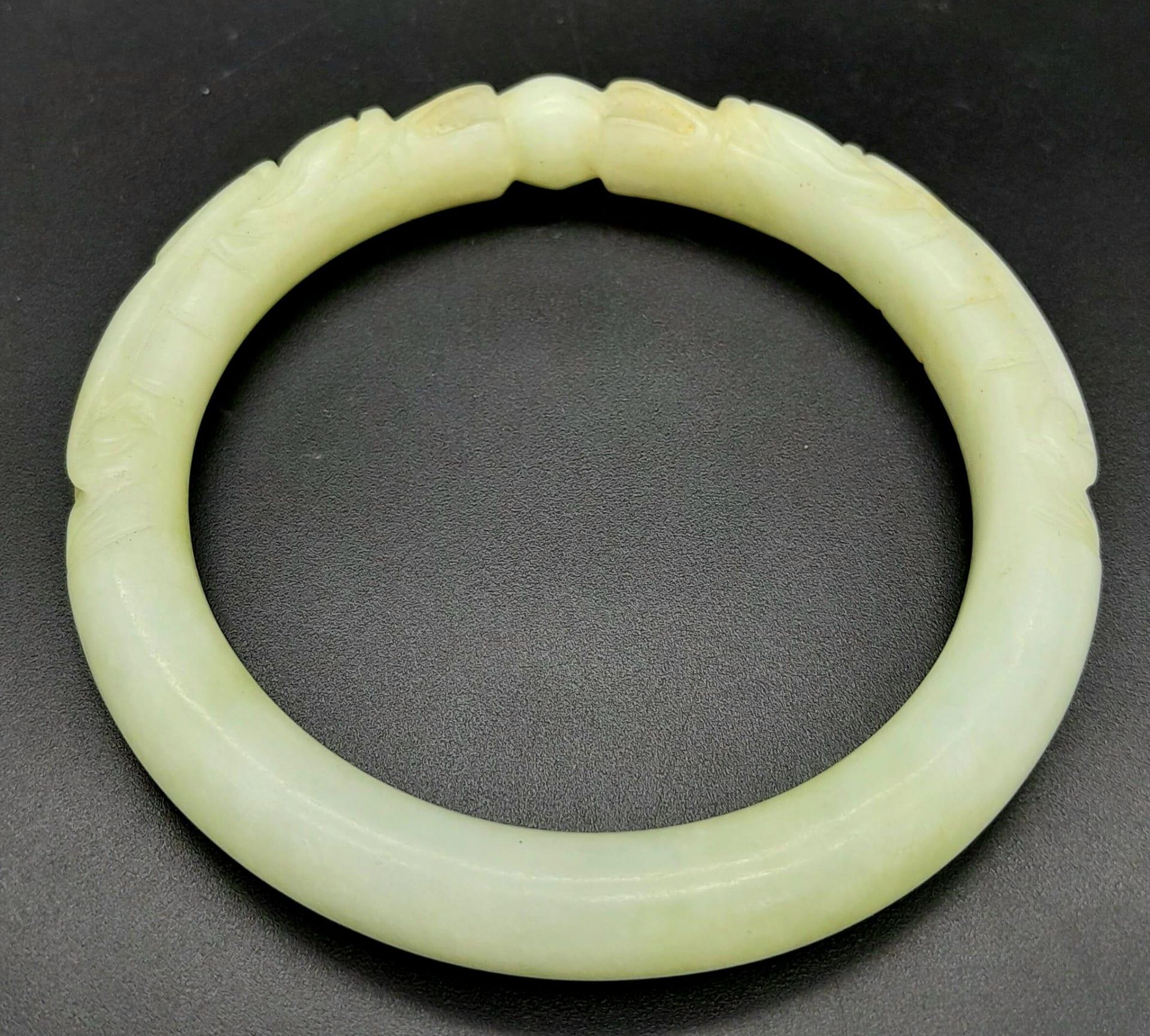 An Antique Chinese Pale Green Double Dragon Jade Bangle. 63mm inner diameter. - Image 4 of 4