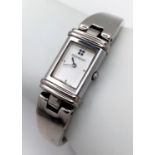 An Yves St Laurent Designer Reverso Quartz Ladies Watch. Stainless steel bracelet and case - 15mm.