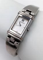 An Yves St Laurent Designer Reverso Quartz Ladies Watch. Stainless steel bracelet and case - 15mm.