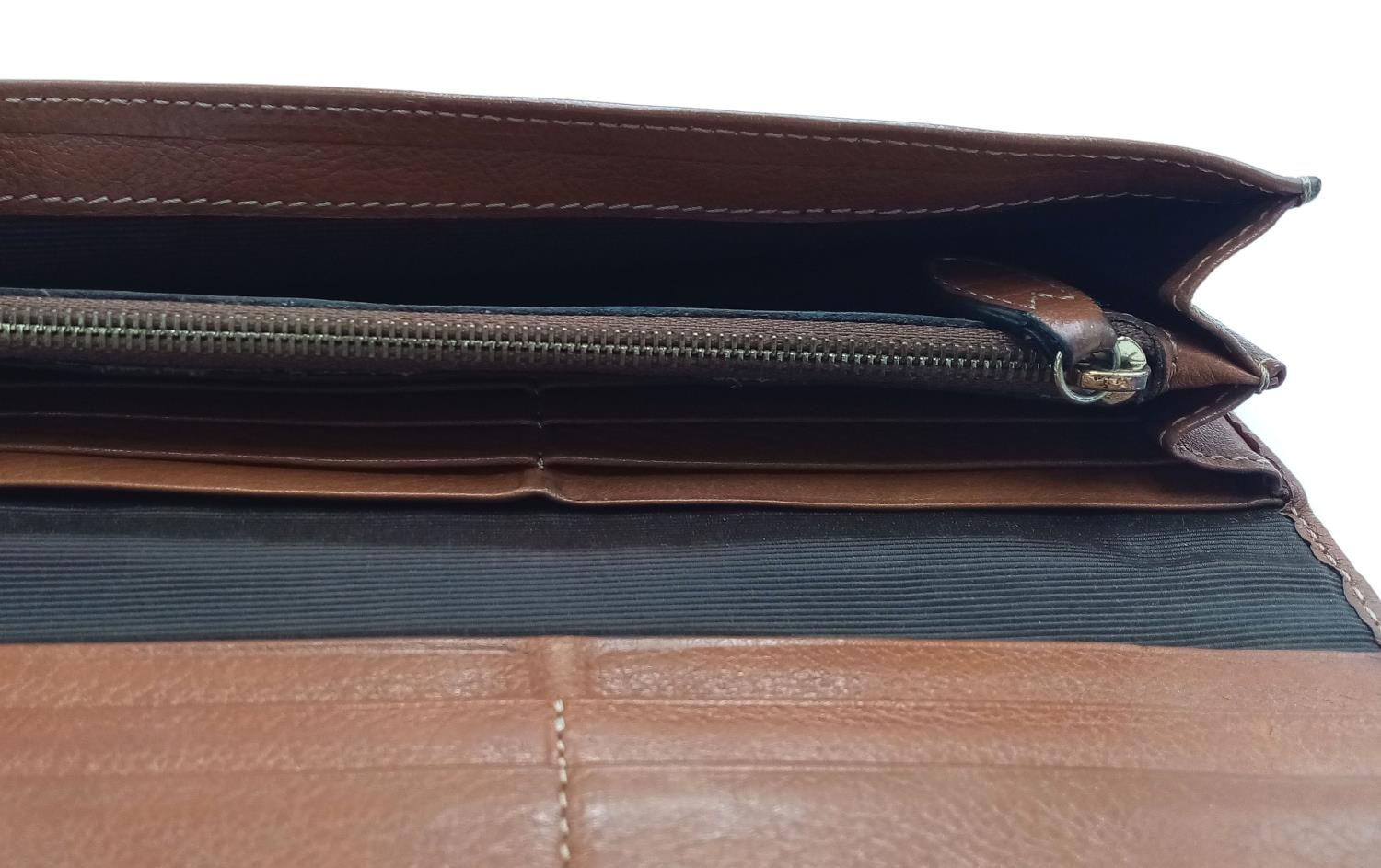 A Mulberry Brown Daria Continental Wallet. Leather exterior with gold-toned hardware, a zipped - Image 2 of 7