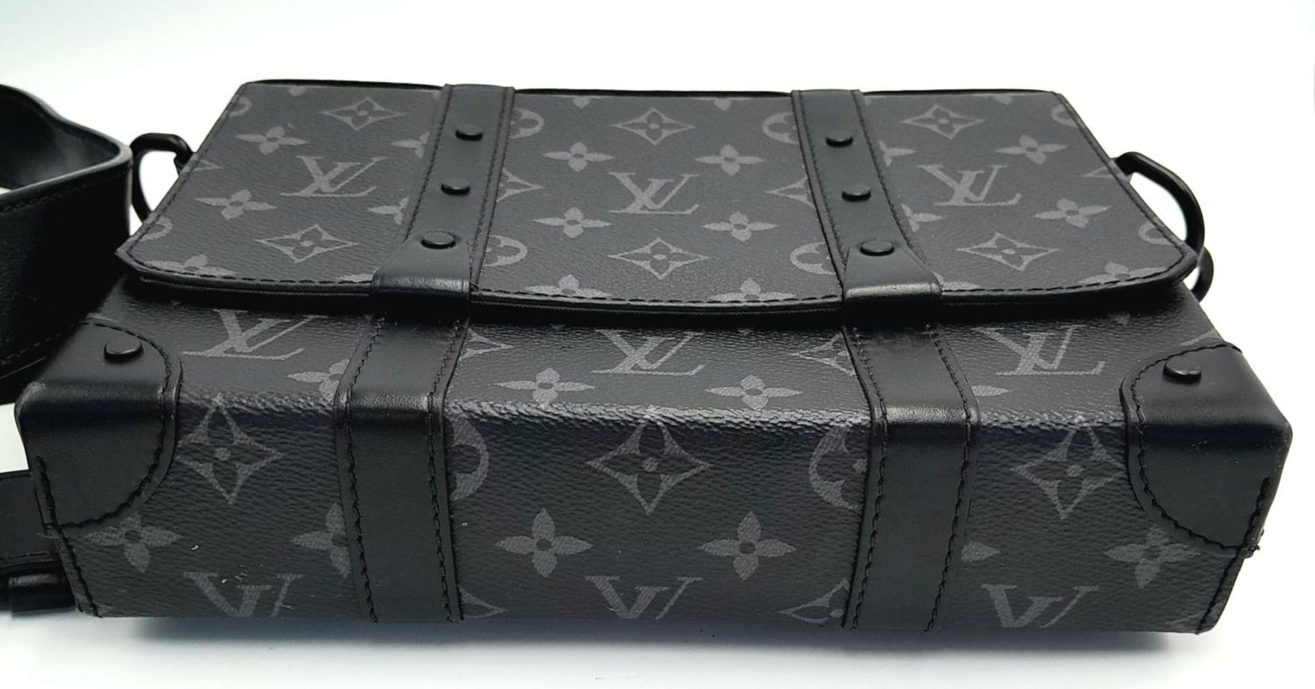 A Louis Vuitton Black Eclipse Trunk Messenger Bag. Monogramed canvas exterior with black-toned - Image 6 of 10
