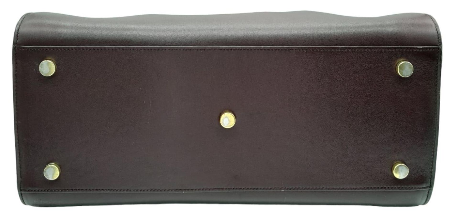 A Saint Laurent Sac De Jour Burgundy Handbag. Leather Exterior, Gold Tone Hardware, Double Handle in - Image 4 of 9