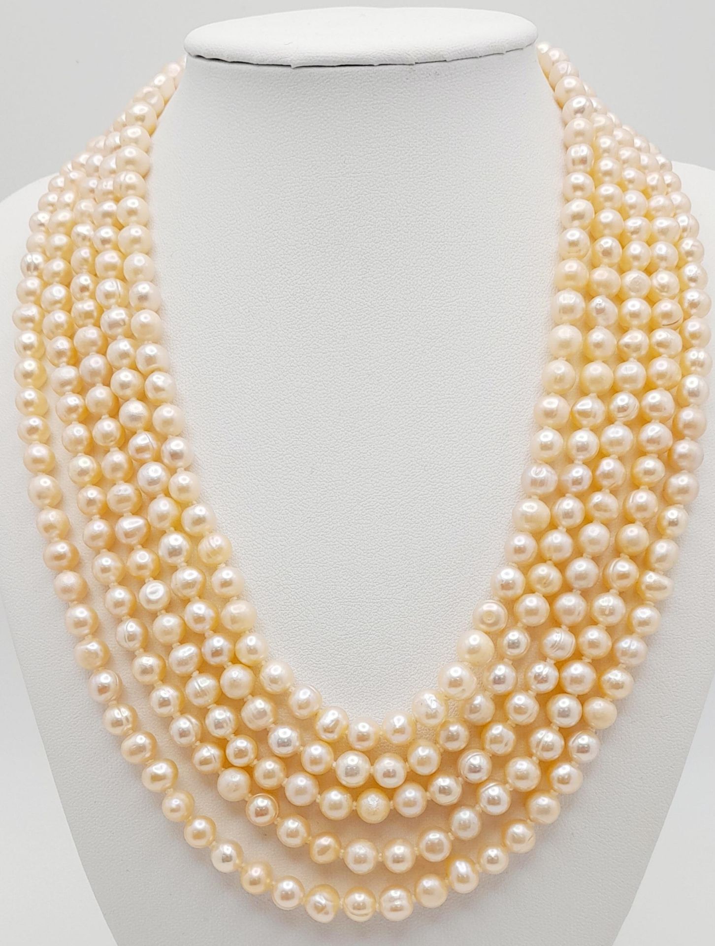 A statement five row pink, cultured pearl necklace accompanied by a pair of pink pearl stud - Image 2 of 4