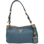 A Prada Marine Blue Vitello Daino Shoulder Bag. Leather exterior with gold-toned hardware,