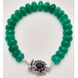 A 130ctw Faceted Rondelle Emerald Bracelet with a sapphire and 925 Silver clasp. 16cm. Ref: CD-1298