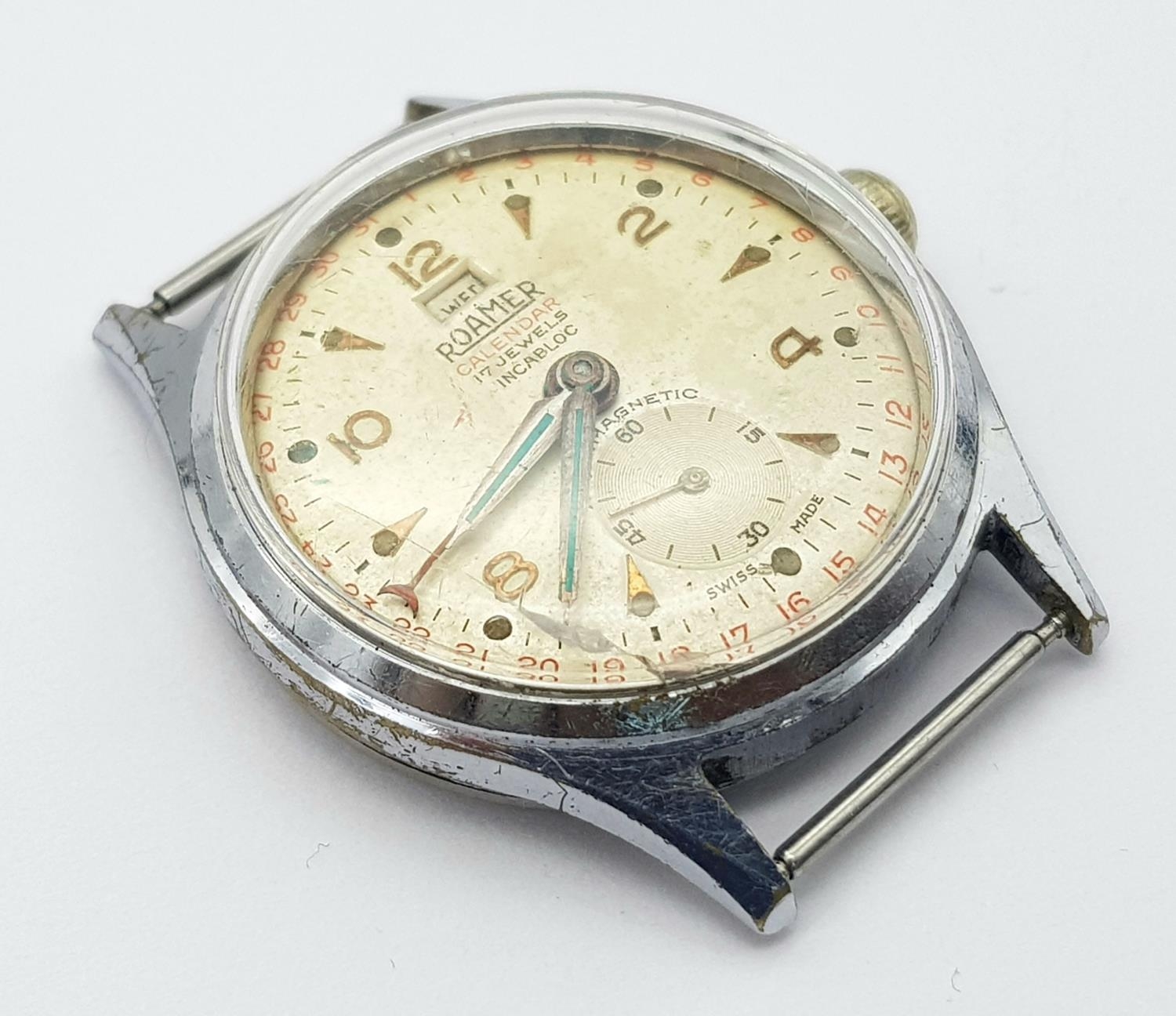 A Vintage Roamer Calendar 17 Jewels Stainless Steel Watch Case -33mm. Patinaed dial with sub dial.