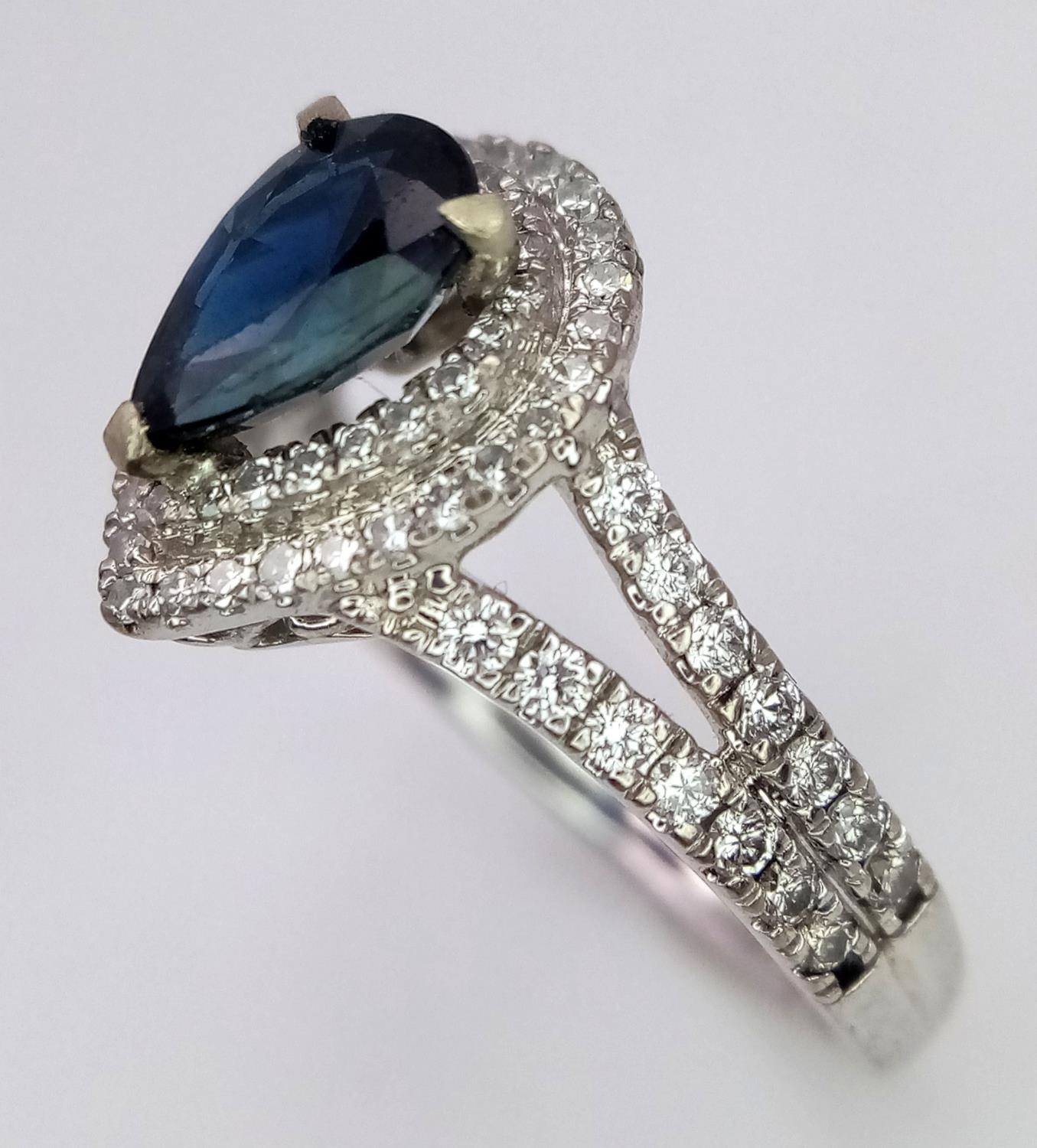 An 18K White Gold Sapphire and Diamond Ring. Teardrop sapphire with a 0.50ctw diamond surround. Size - Image 3 of 5