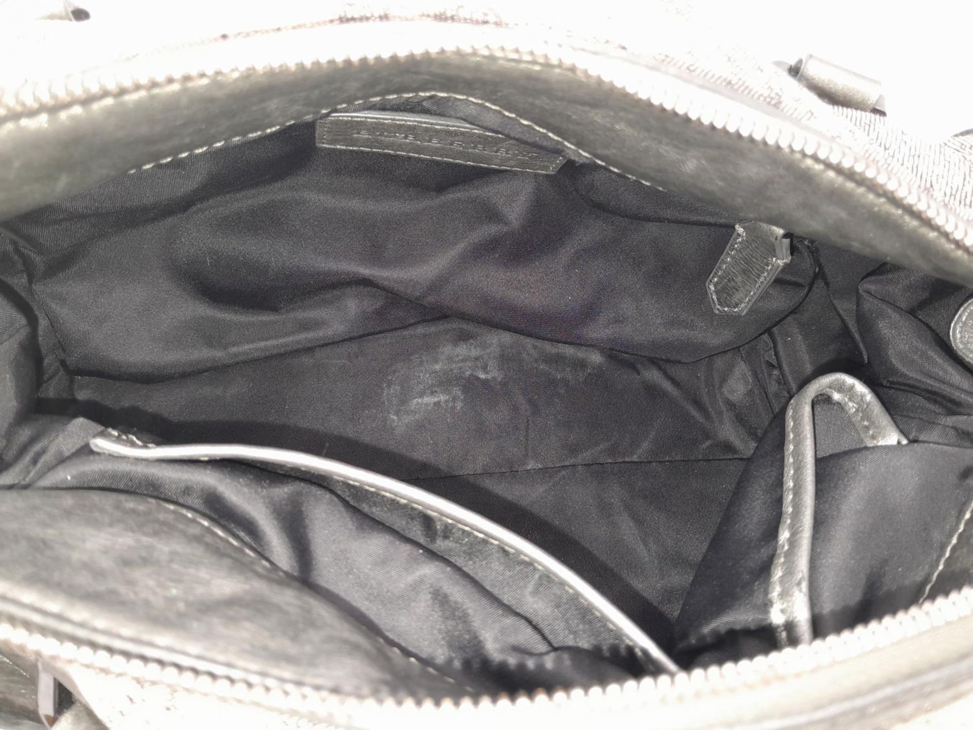 A Burberry Metallic Grey Smoke Check Bag. Canvas exterior with leather trim, leather straps, black- - Bild 8 aus 9