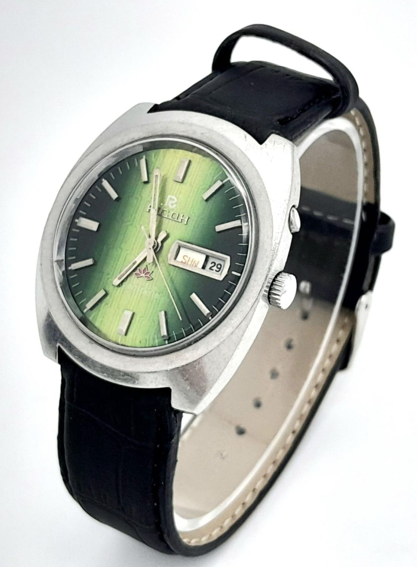 A Vintage Ricoh Automatic Gents Watch. Black leather strap. Stainless steel case - 38mm. Green