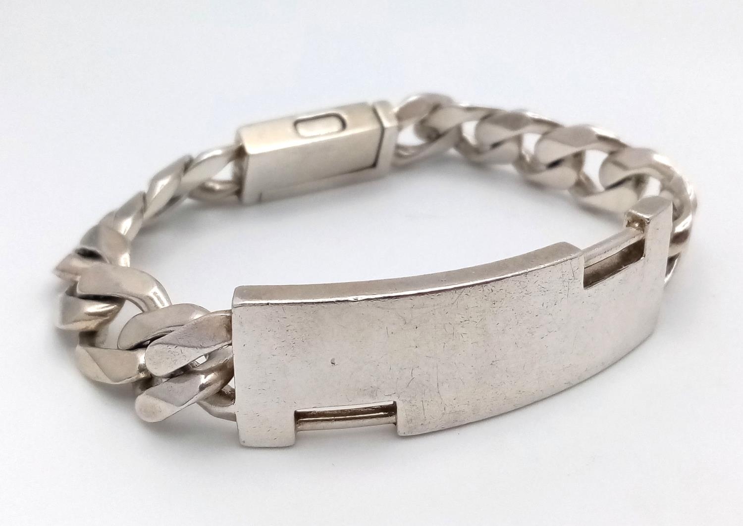 A Sterling Silver ID Bracelet, 12” length, 68.8g total weight. ref: 1493I