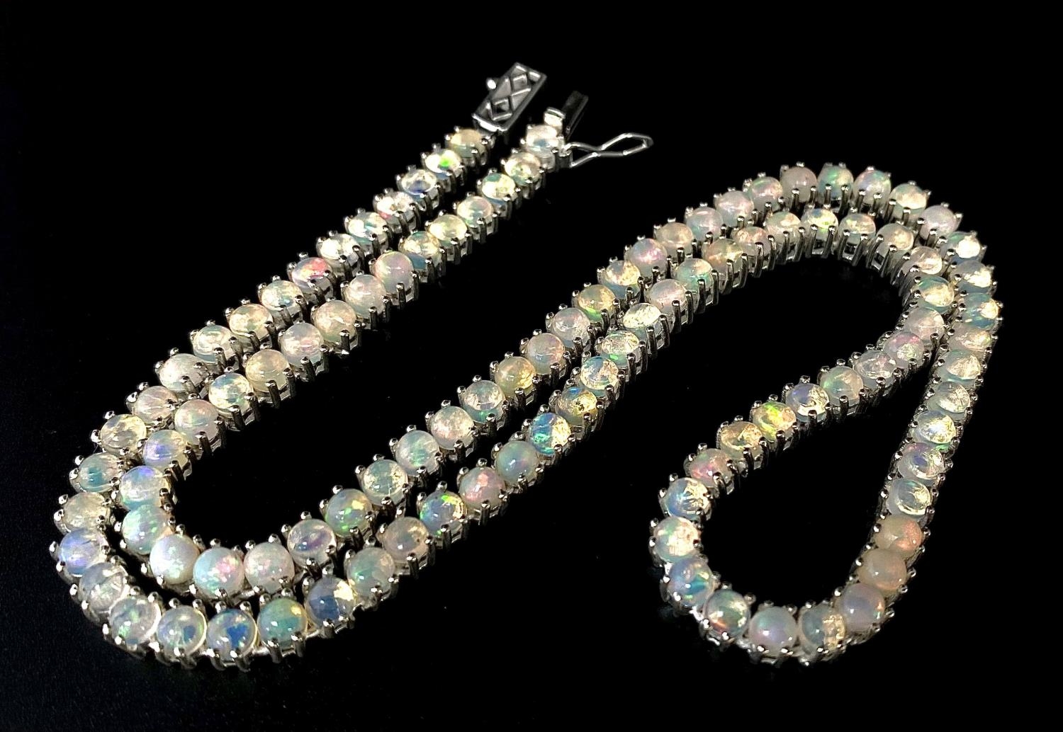 A Fire Opal Gemstone Tennis Necklace set in 925 Silver. 45cm length. 31g. Ref: CD-1314