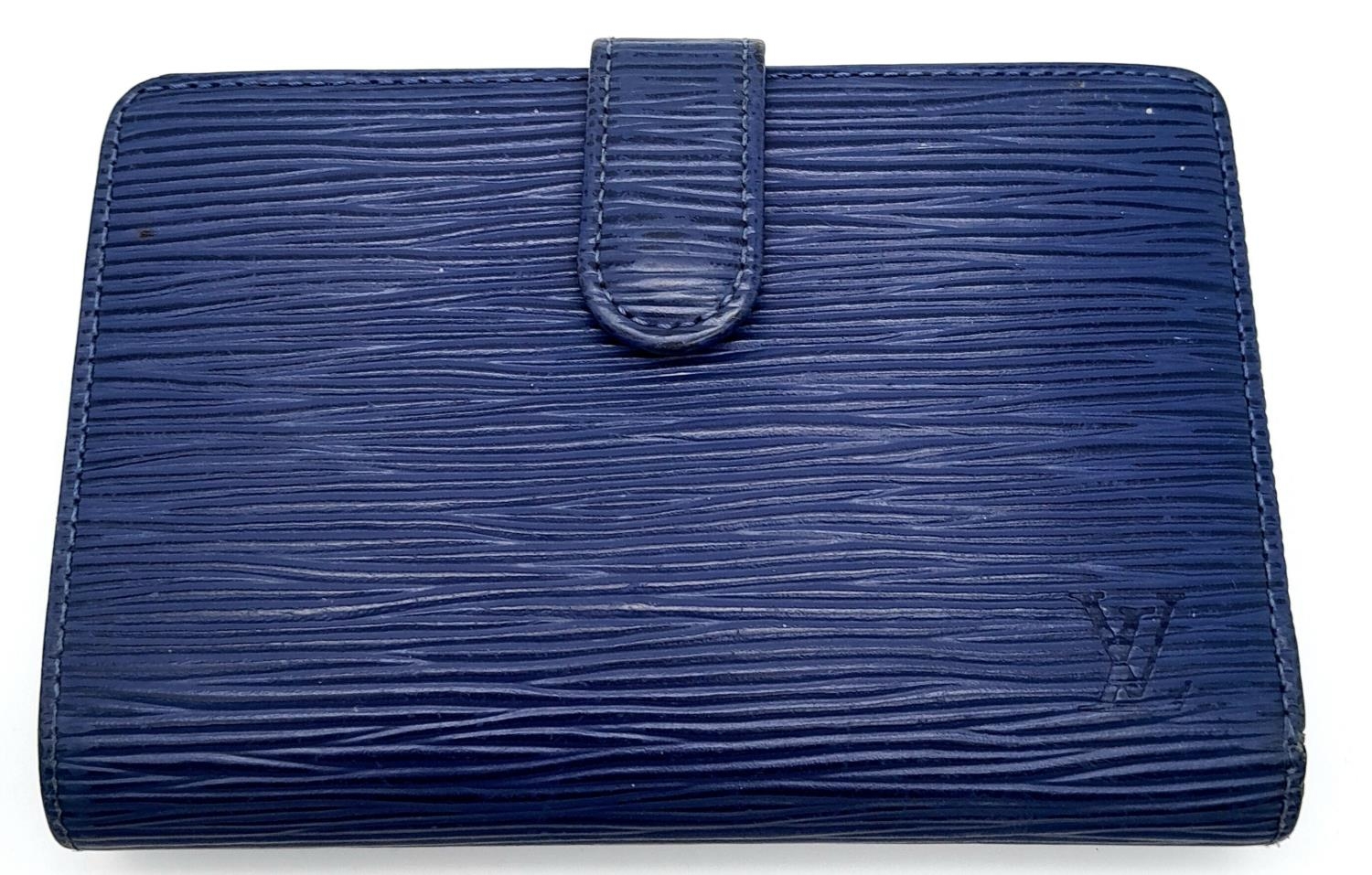 A Vintage Louis Vuitton Blue Bifold Wallet. Epi leather exterior with silver-toned hardware and - Image 2 of 17