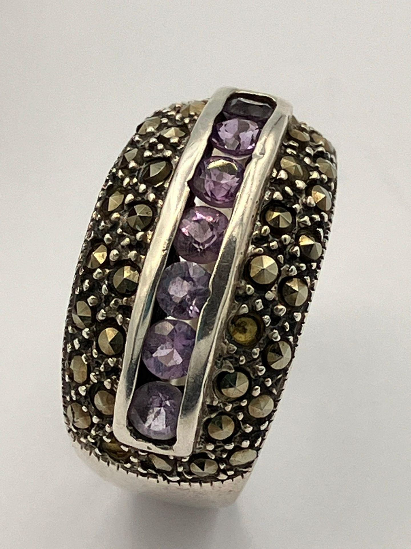 Vintage SILVER MARCASITE RING,set with AMETHYSTS to centre. Complete with ring box. Size Q 1/2 - R.