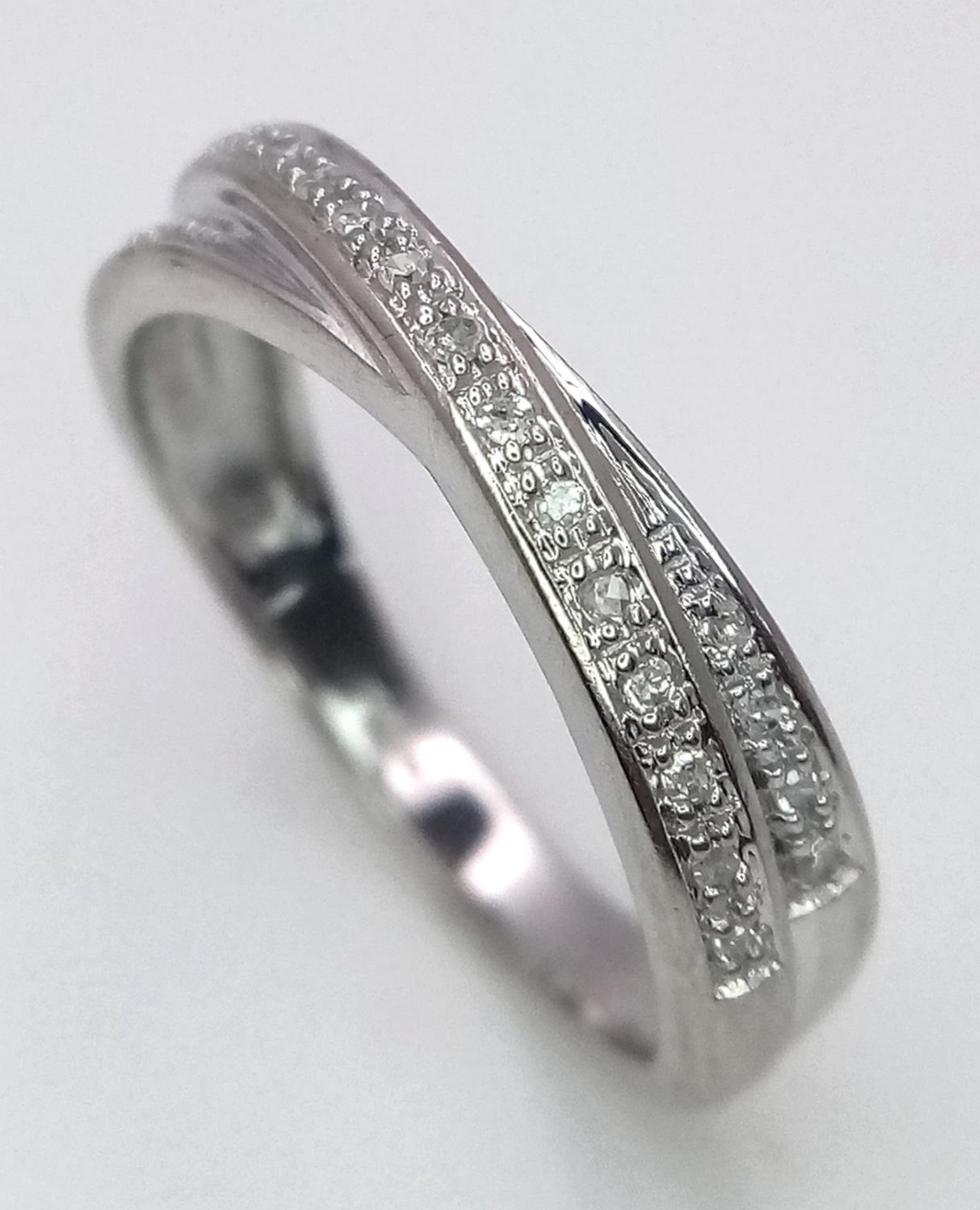 A 9K WHITE GOLD DIAMOND SET 2 ROW CROSSOVER RING 2.7G SIZE O/P. SC 9071 - Image 2 of 6