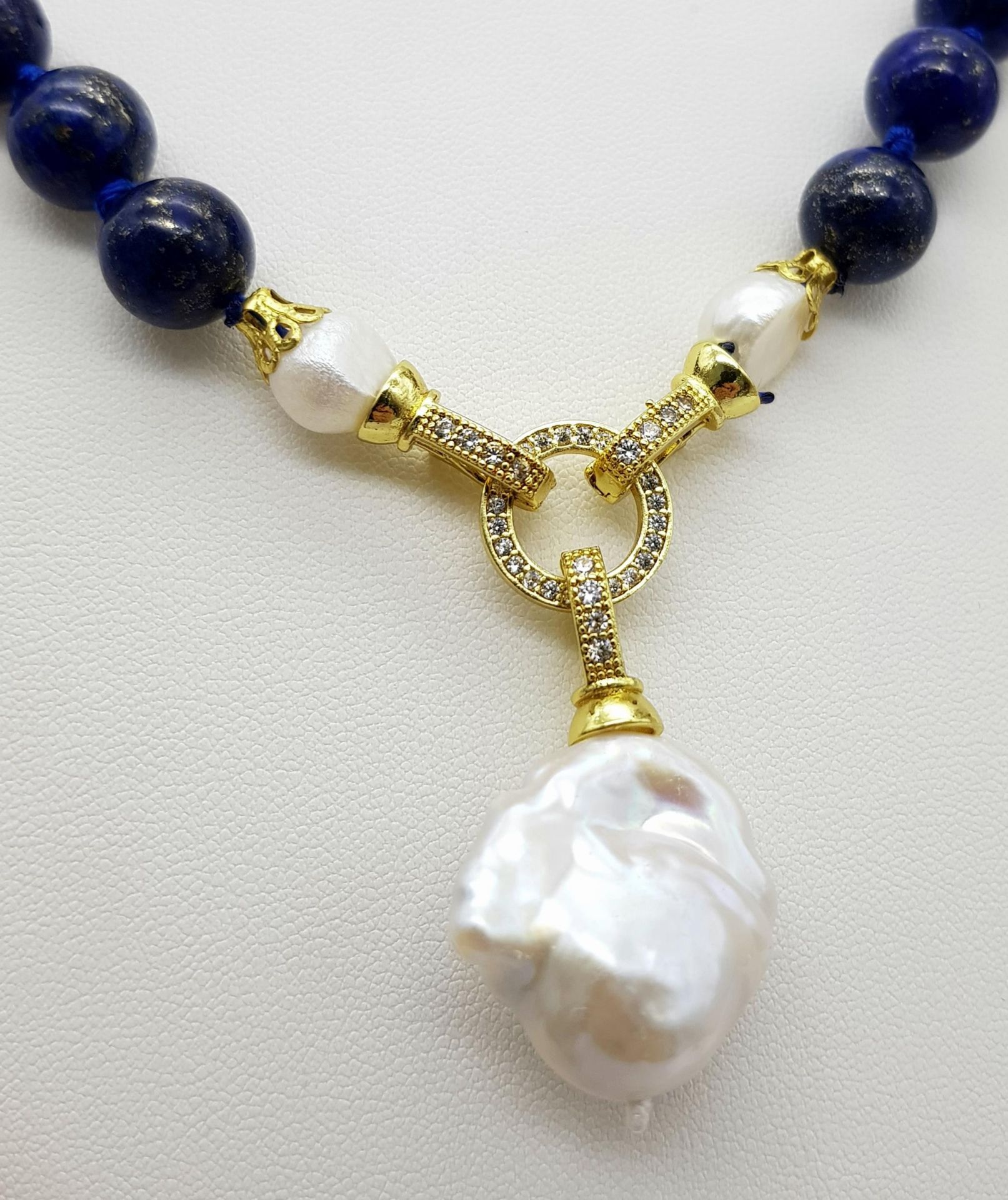 A Lapis Lazuli Beaded Necklace with Baroque Pearl Pendant. 10mm beads. Pendant - 6cm. Necklace - Image 2 of 4