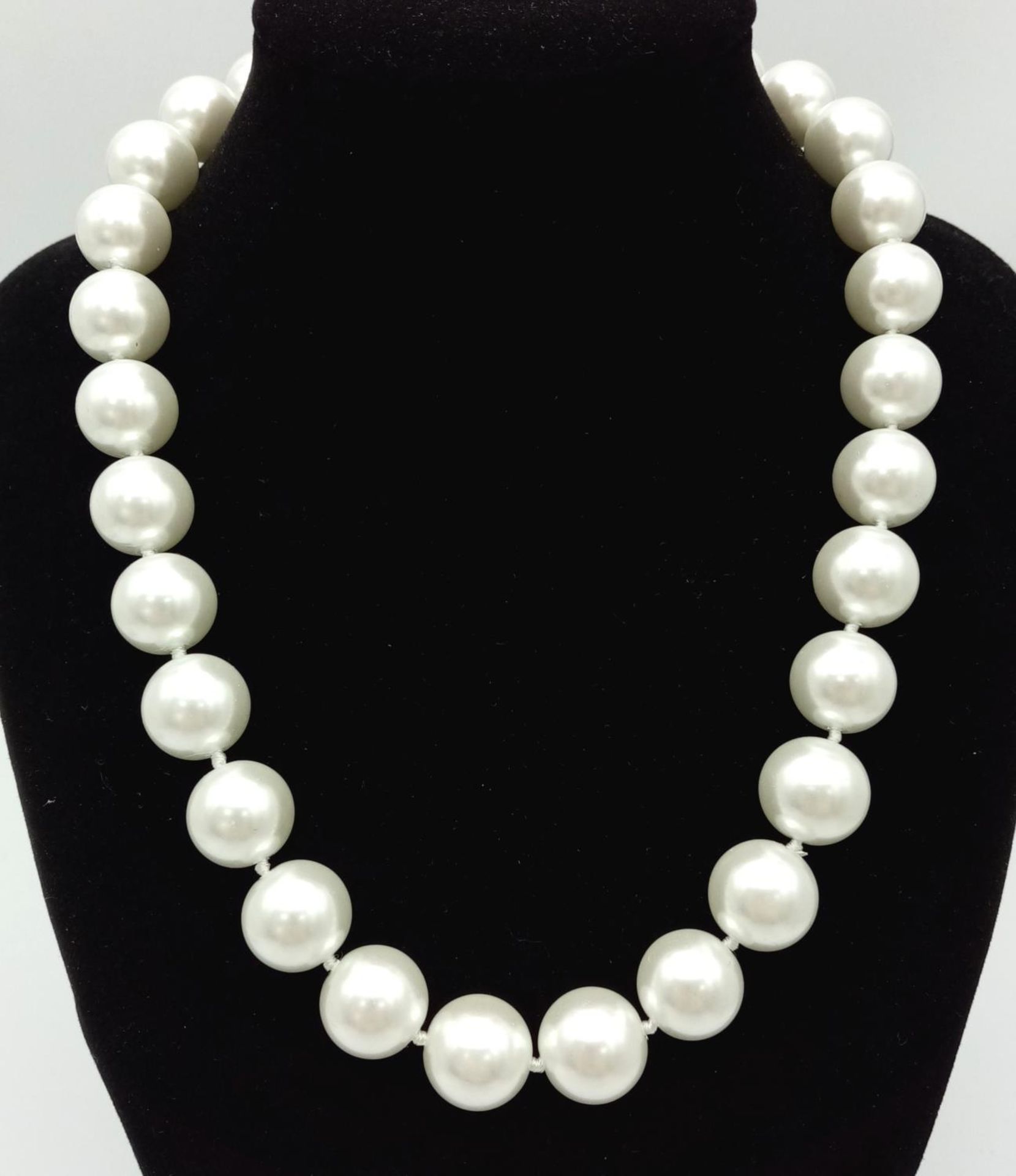 A White South Sea Pearl Necklace with Heart Clasp. 14mm beads. 44cm necklace length.