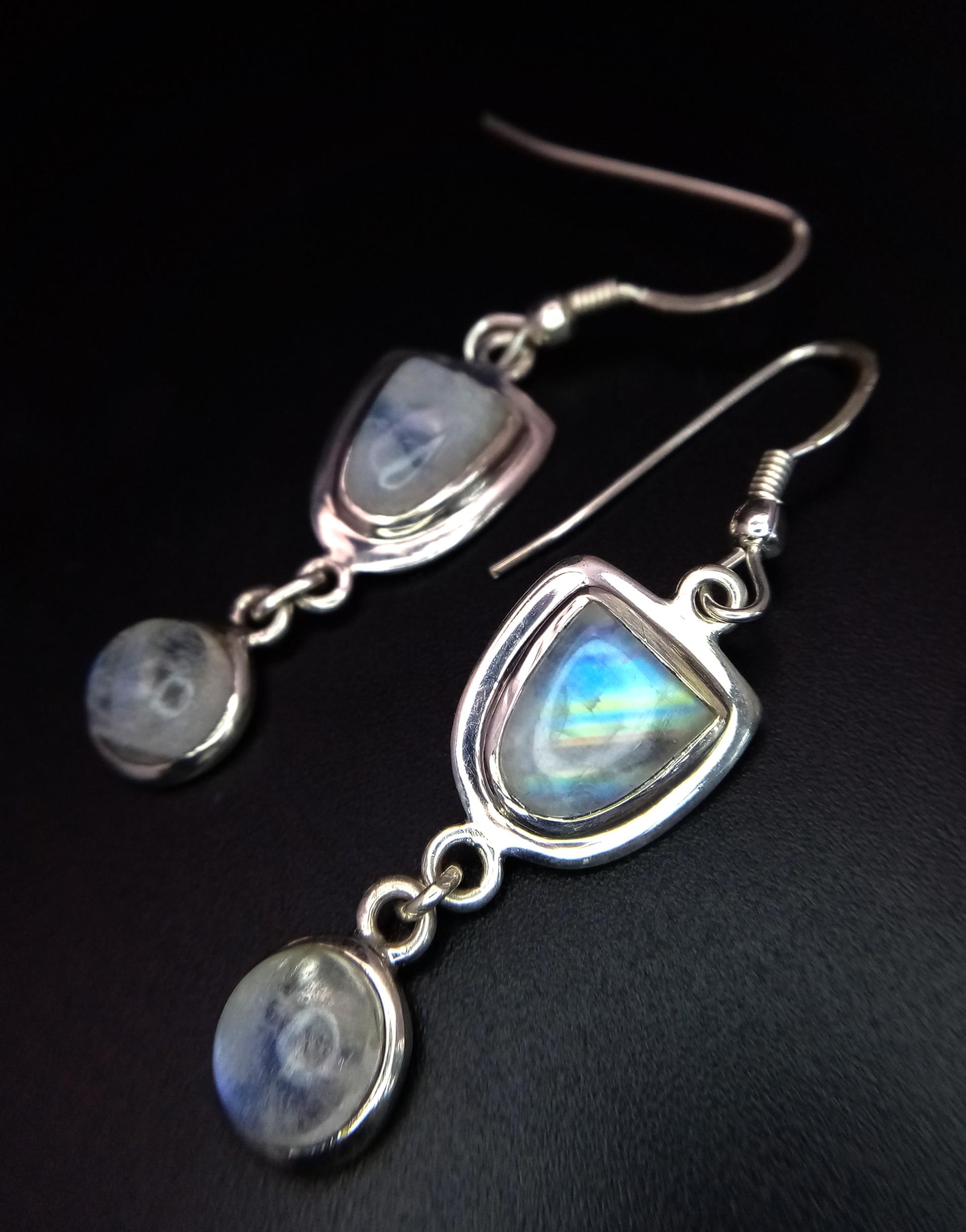 A Pair of Sterling Silver Rainbow Moonstone Earrings. 4.5cm Drop. Set with a 9mm Long Fancy Cut