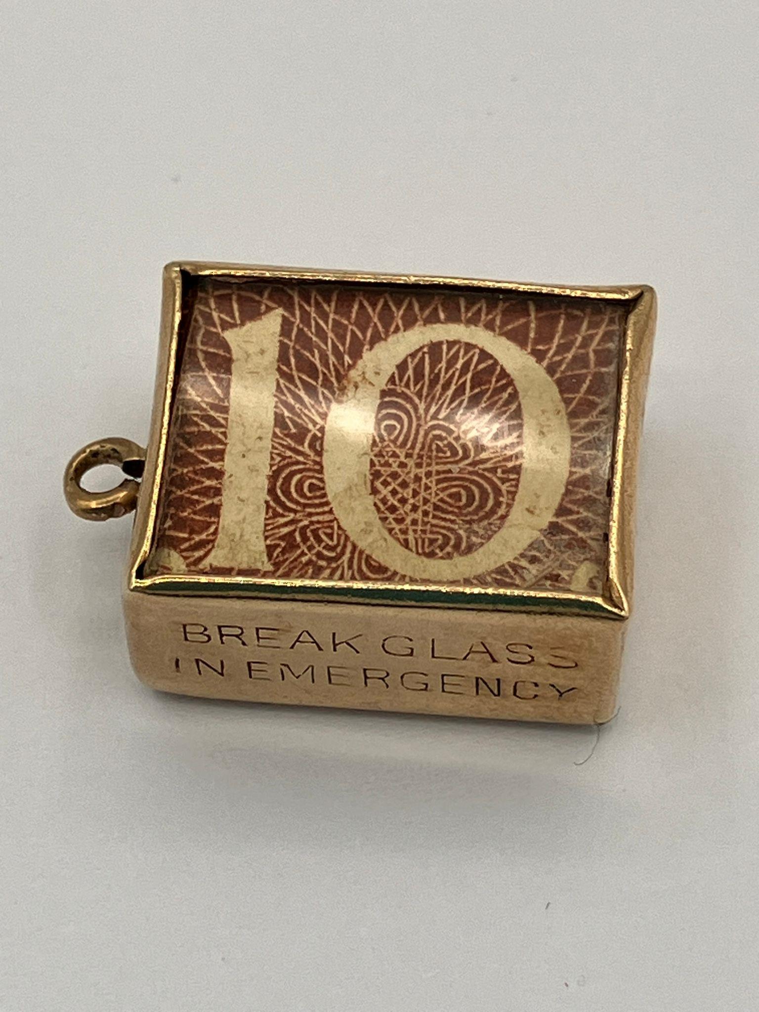 Vintage 9 carat GOLD CHARM. Having a 10 Shilling Note folded inside a GOLD CASE. Full UK Hallmark.